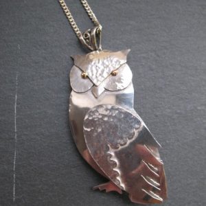 Silver and 18ct gold owl pendant with moving wing 2009