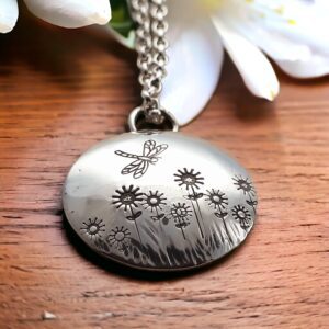 Handmade silver daisy and dragonfly pendant