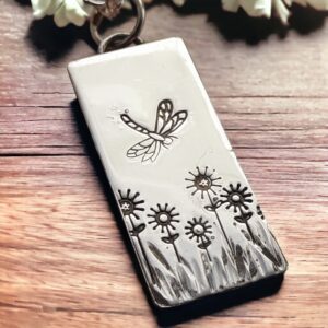 Silver daisy and dragonfly necklace