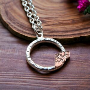 moth on circle silver and copper necklace