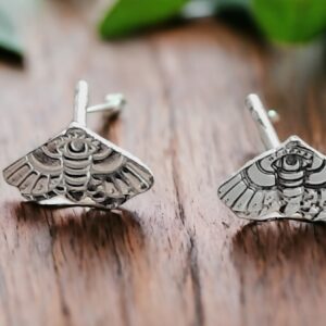 Tiny silver moth stud earrings