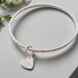 Broch silver hammered bangle with dandelion heart charm