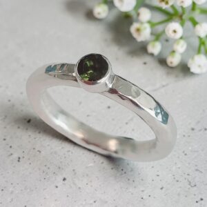 Silver handmade hammered ring with green tourmaline