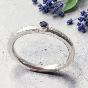 Silver handmade solid hammered ring with sapphire