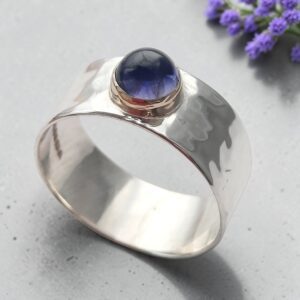 Silver hammered ring with stunning iolite set in gold